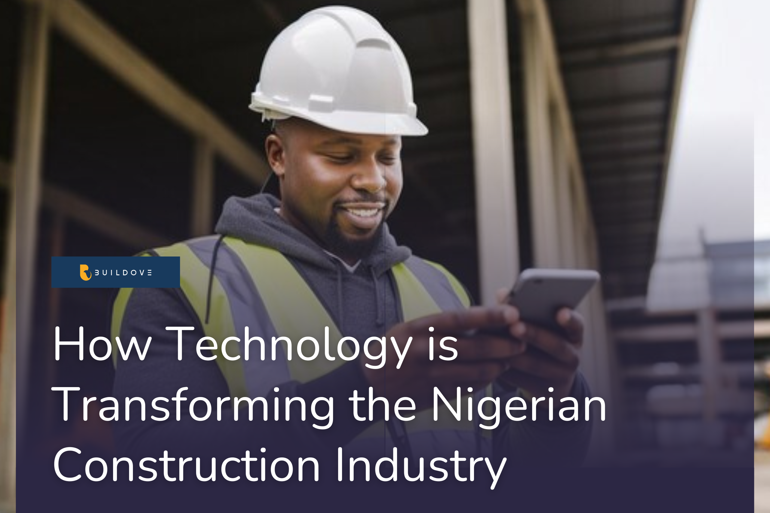 A happy construction professional looking at a mobile phone