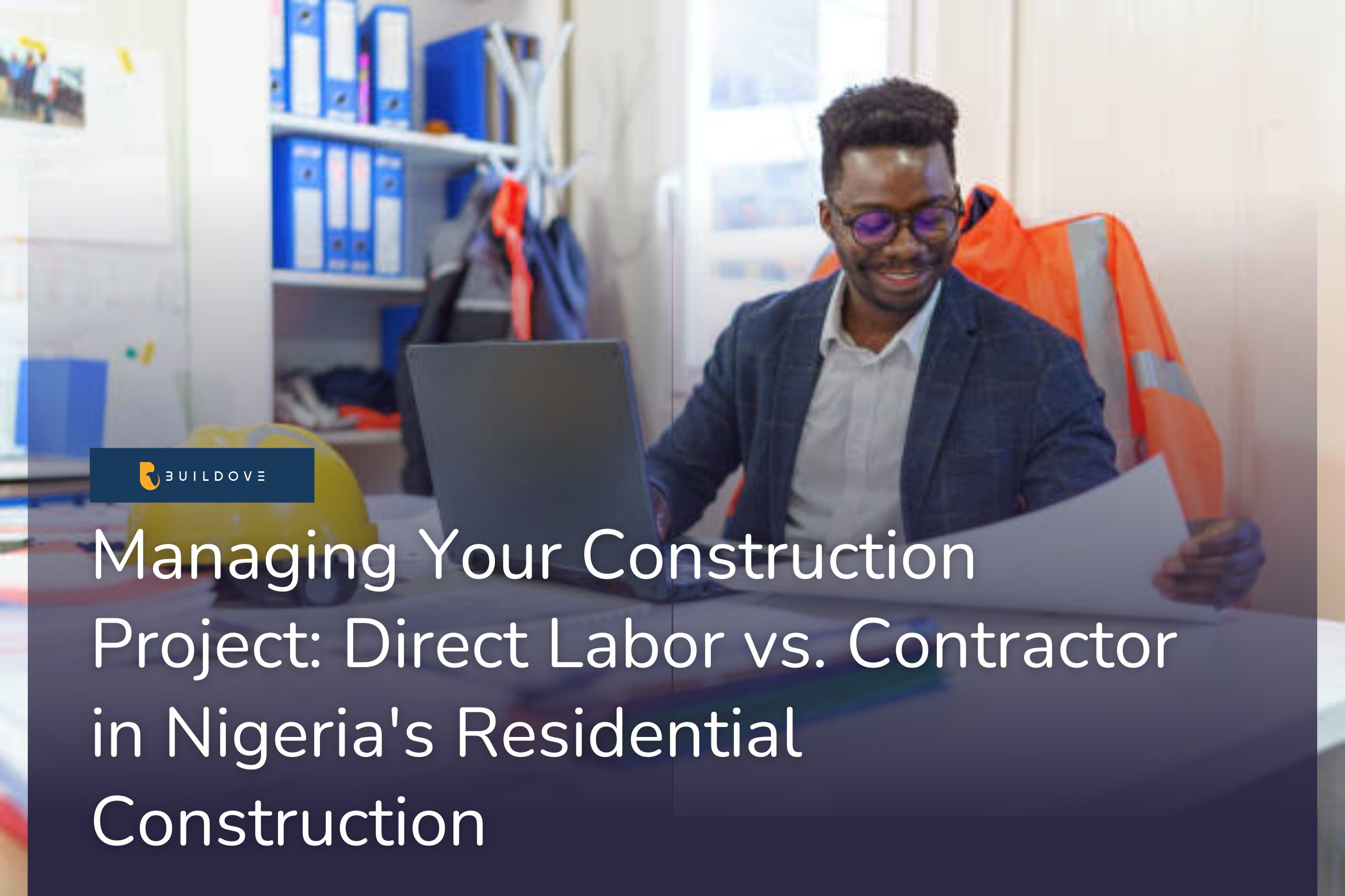 A happy construction professional on a laptop looking at a construction plan